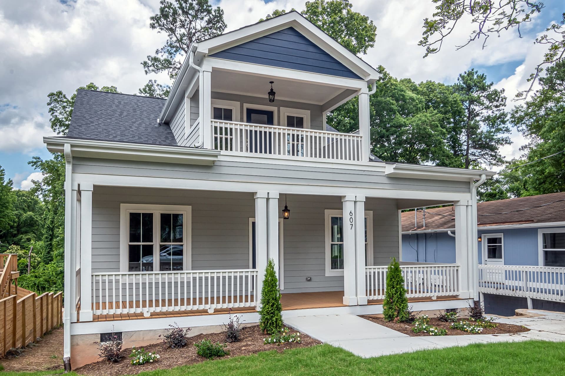 Two-story home with a full-width columned front porch